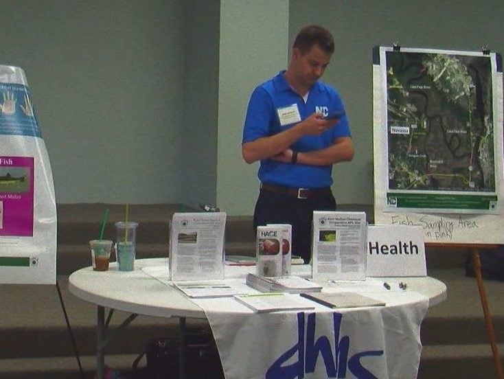 A representative from the NC Department of Health and Human Services takes part in public session in Navassa on June 20