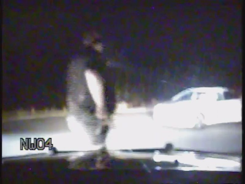 Ofc. Jacob Schwenk approaches Brent Quinn's car in Leland on Dec. 9