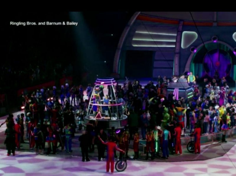 The cast of Ringling Bros. and Barnum & Bailey Circus gather to sing "Auld Lang Syne" after the circus's final performance on May 21