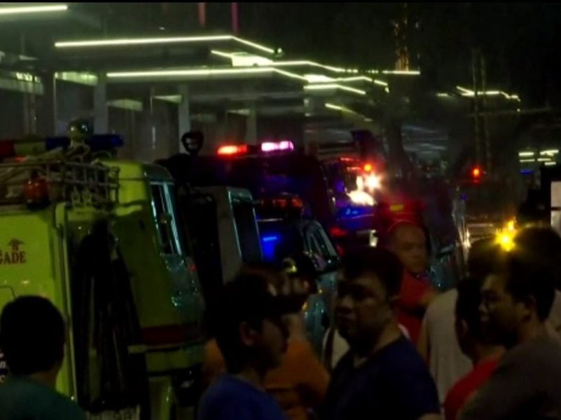 Police respond to reports of gunfire and explosions in a tourist area in Manilla