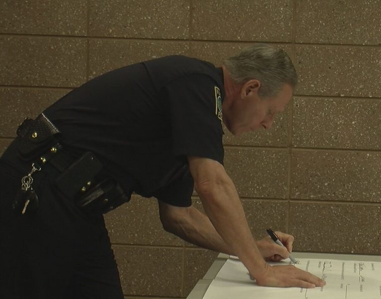 Chief Ralph Evangelous signing the memorandum for the Law Enforcement Assisted Diversion program on May 17