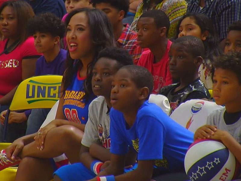 WWAY's Amanda Fitzpatrick sits on the bench during the Harlem Globetrotters' game on April 2