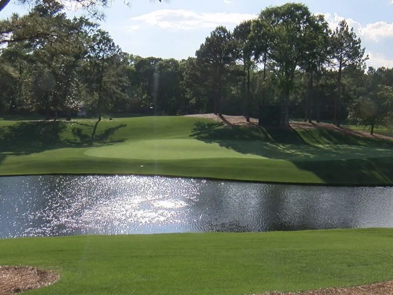 A pond sits next to the green at Eagle Point Golf Club's 12th hole. (Photo: WWAY)
