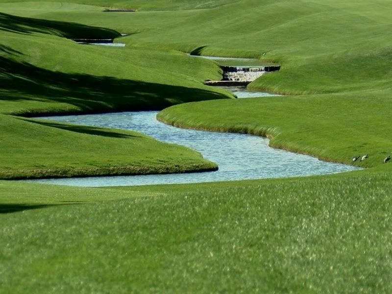 A creek meanders along the fairway of the 6th hole at Eagle Point Golf Club. (Photo: WWAY)