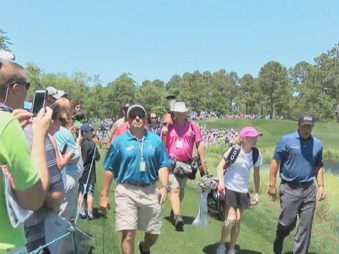 Kids involved in the First Tee of greater Wilmington got to spend the afternoon caddying for the professional players in the Wells Fargo Championship.