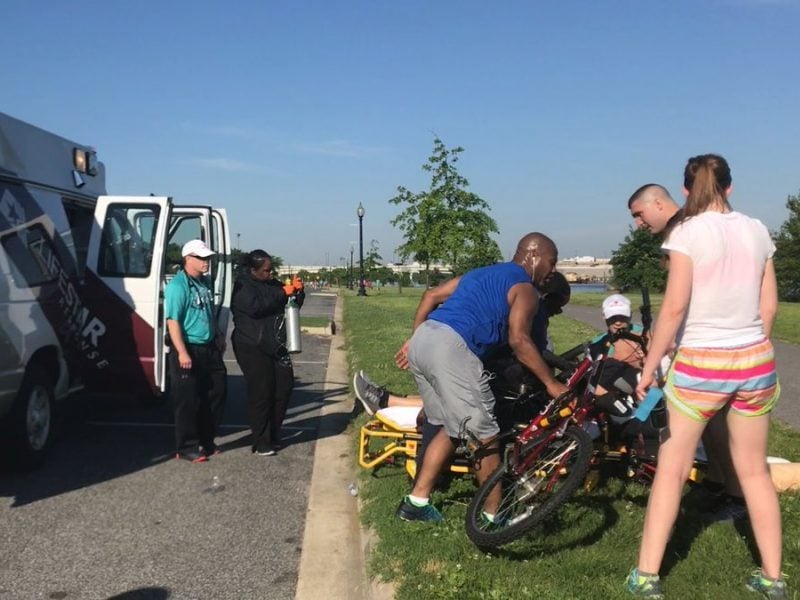 Several people rush to help Sen. Thom Tillis (R-NC) after he collapsed during a race in Washington