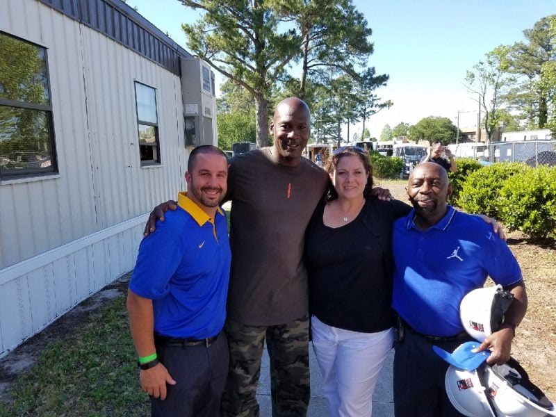 Basketball great Michael Jordan poses for a photo at Laney High School on May 2
