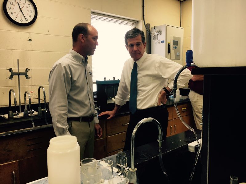 Gov. Roy Cooper (right) visits the Brunswick County Water Treatment Plant in Leland on Aug. 24