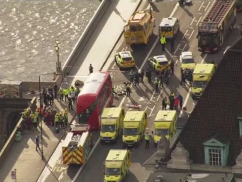 Emergency crews respond to London's Westminster Bridge after attacks near British Parliament on March 22