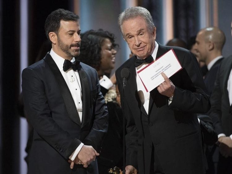 Jimmy Kimmel (left) watches as Warren Beatty explains the mistake made in announcing the Best Picture Award at the 89th Oscars on Feb. 26