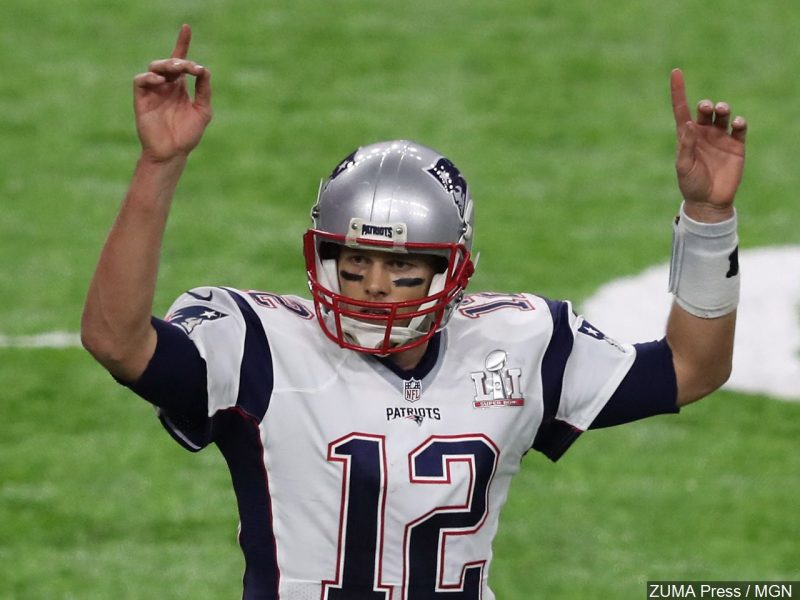 Tom Brady of the New England Patriots raises his hands in celebration during Super Bowl LI.