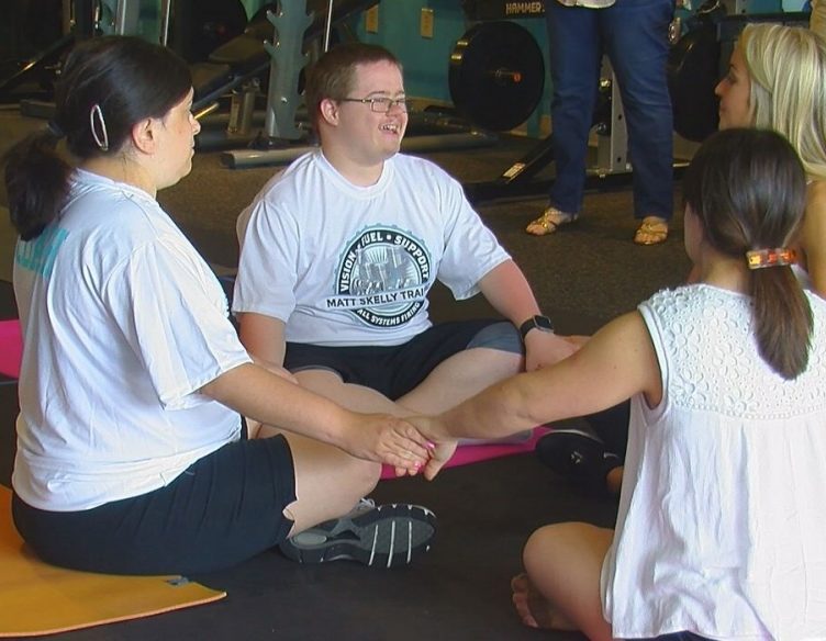Members of the Train us forward fitness class getting ready for some yoga during their Sunday class.
