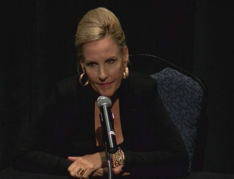 Erin Brockovich speaking at a GenX forum at UNCW on August 16