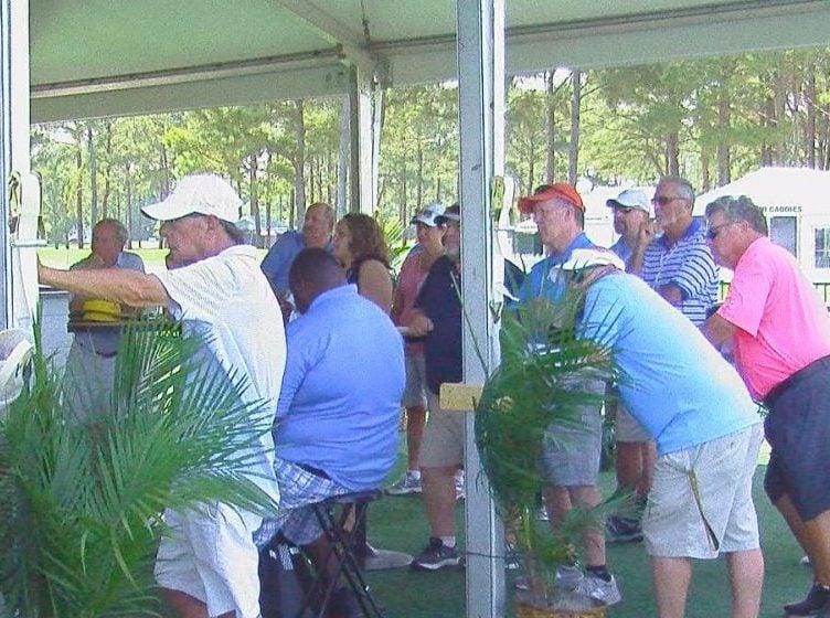 A group of volunteers learning about protocol for an emergency during the tournament.