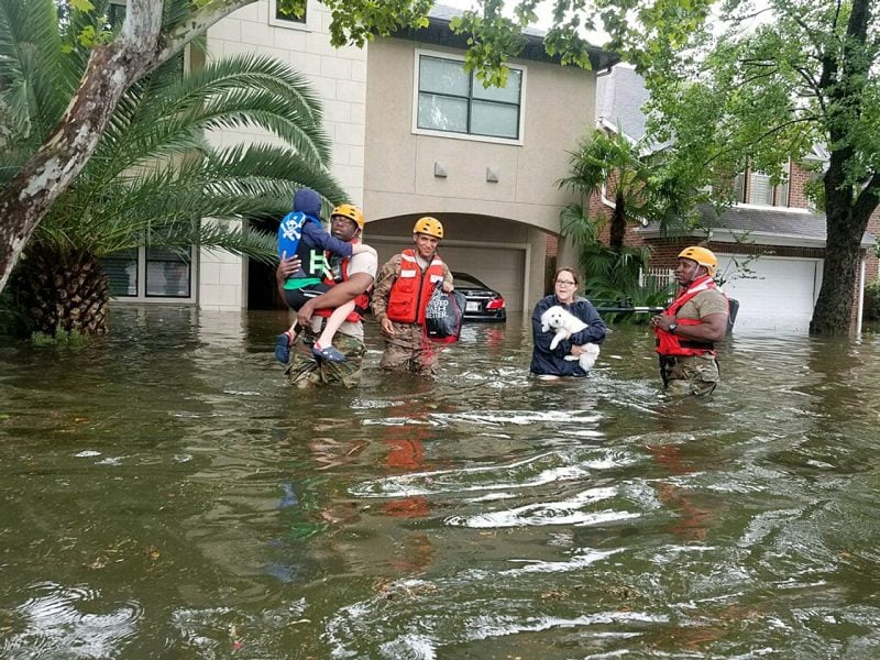 Members of the Texas National Guard help rescue flood victims in Houston on Aug. 28