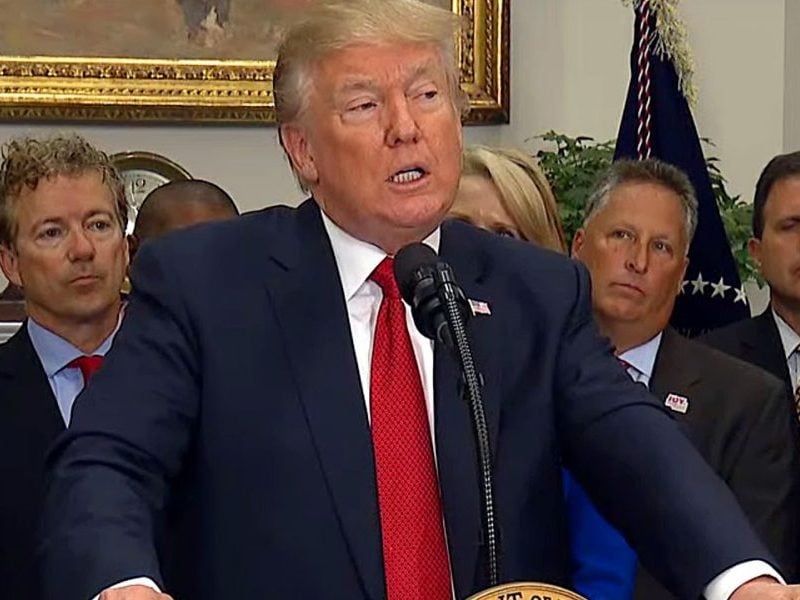 President Donald Trump speaks before signing an executive order on Oct. 12