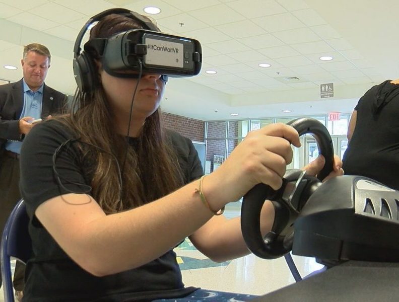 Students trying out the virtual reality system to experience the results of texting while driving on September 27