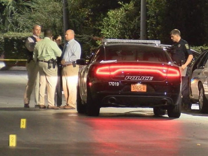 Detectives investigate a shooting death in the parking lot of Jungle Rapids in Wilmington on Oct. 18