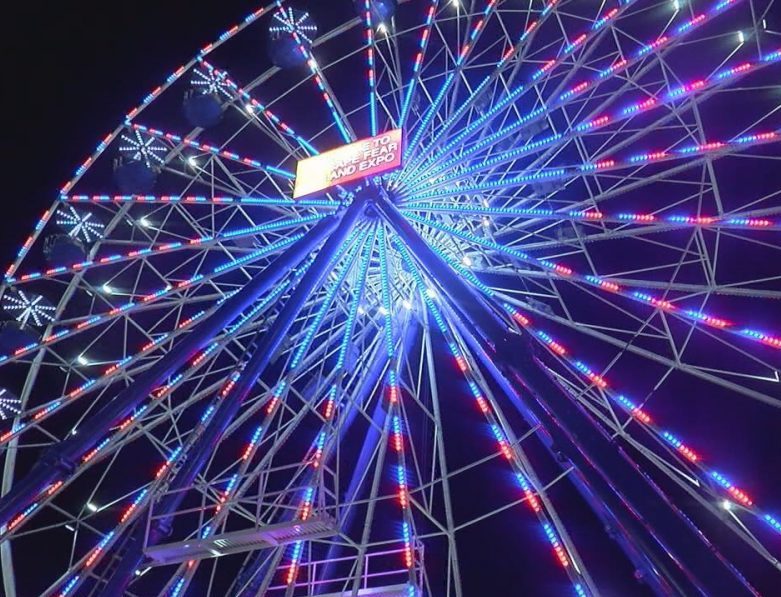 The ferris wheel is lit up on opening night of the Cape Fear Fair & Expo on October 28
