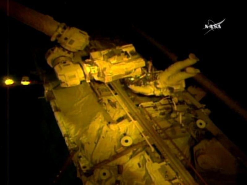 Astronauts perform a spacewalk to repair a cameras on the robotic arm on the International Space Station on Oct. 20