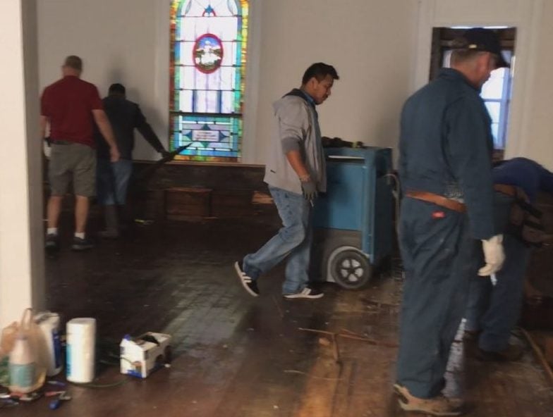 Members of the Wrightsville Beach Baptist Church and some volunteers helping rebuild the church in Currie.