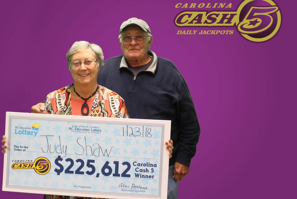 Judy Shaw of Wilmington and her husband pose with their jackpot check on Jan. 23