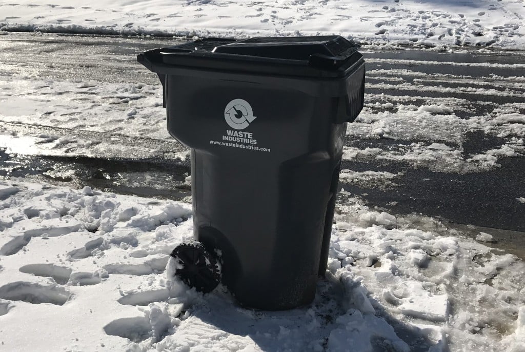 A residential garbage can waits to be picked up in Brunswick County on Jan. 4