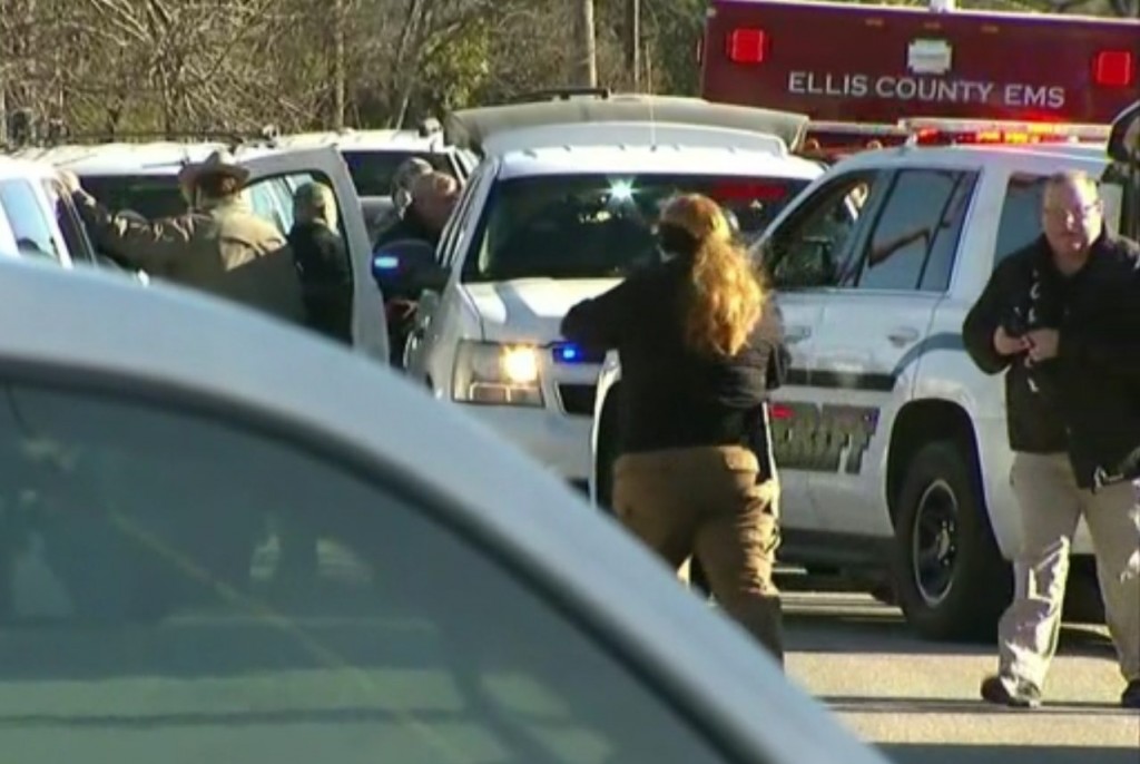 Investigators at the scene of a school shooting in Italy