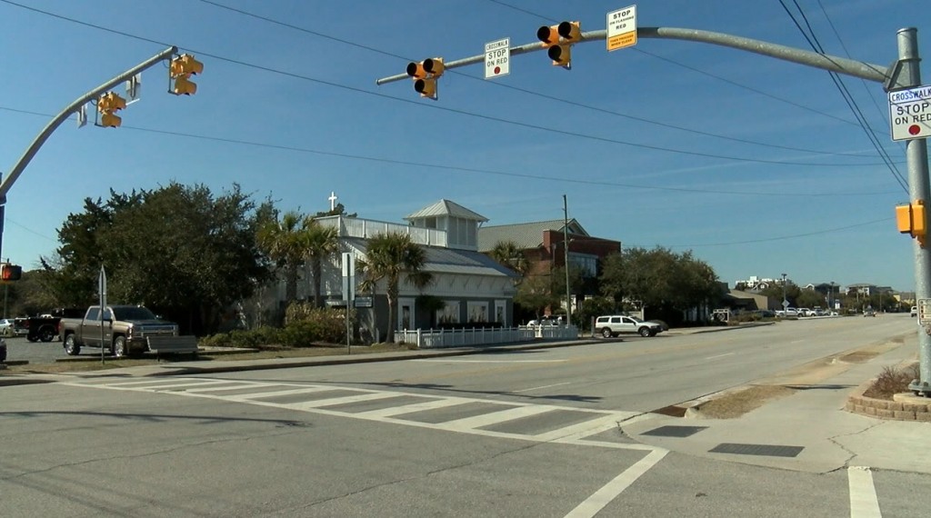 A police officer would press the button activating the system and other officers would wait to see if anyone would keep driving past the red light. (Photo: Basil John/WWAY)