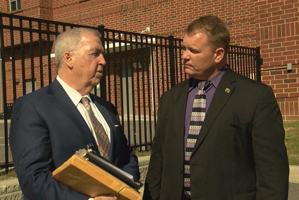 Herring speaking with his attorney after the judge declared he was not guilty on April 20