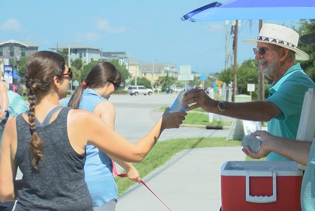 LT Hines and other congregation members giving out water to runners on June 3