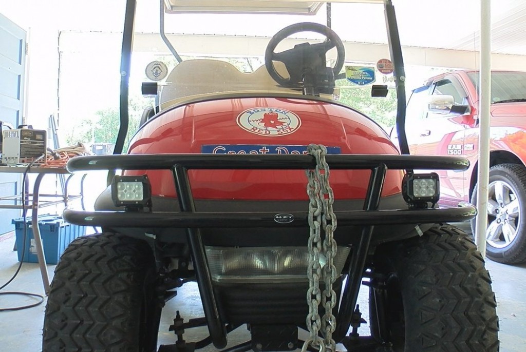 A golf cart in Carolina Beach secured with chain to a house on June 4