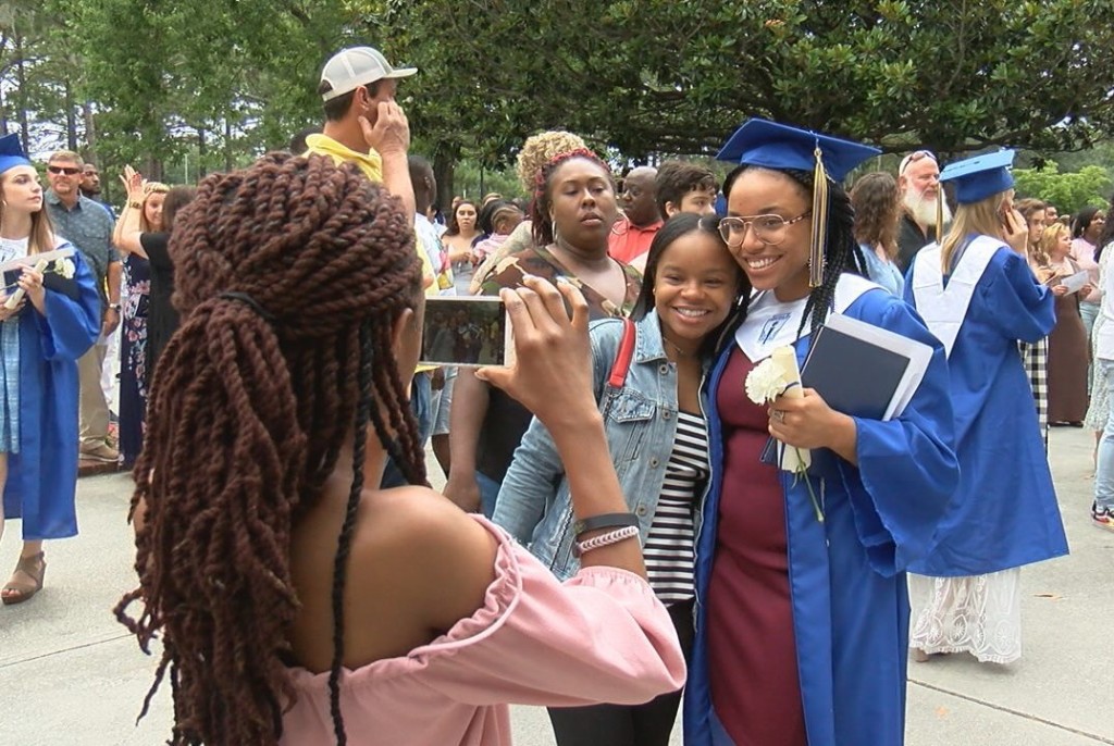 Graduates rushed to find their families to take pictures after receiving their diplomas.