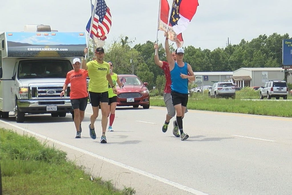 Runners coming down Highway 17 as they make their way to Bolivia.