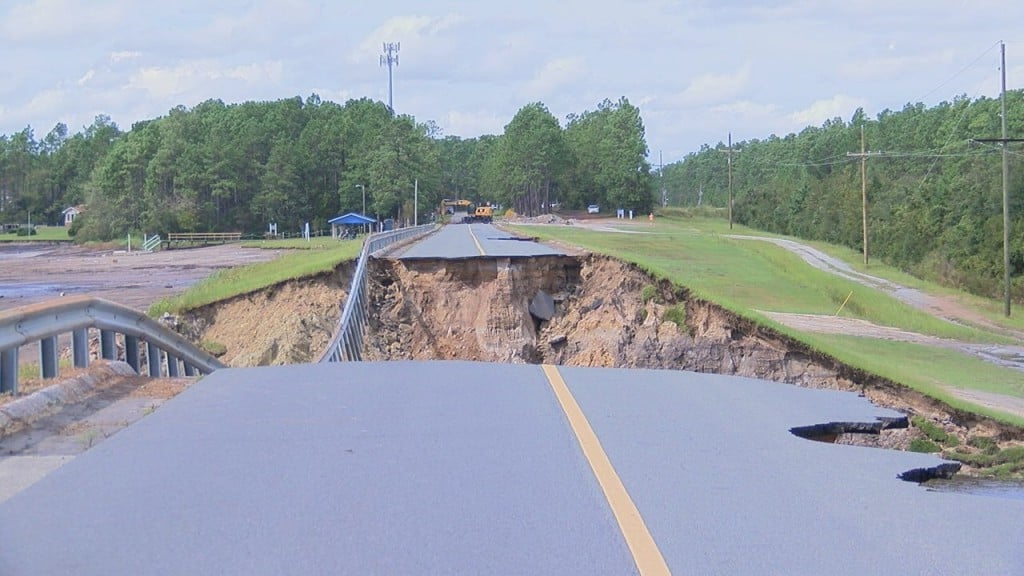 A dam breach at The Big Lake caused Alton Lennon Road to break apart and crumble. (Photo: Kylie Jones/WWAY)
