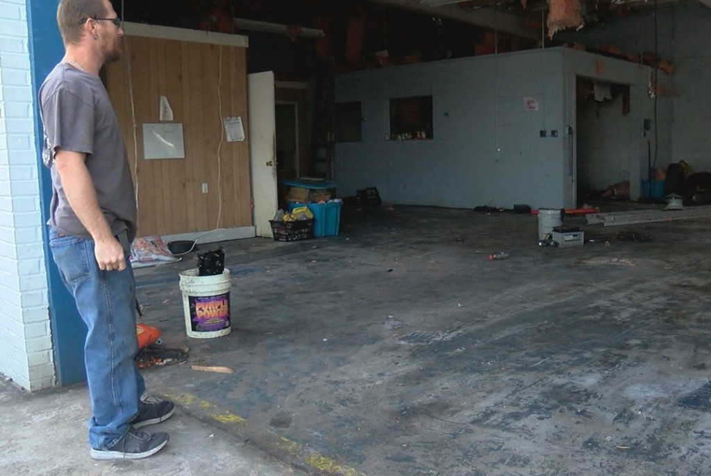 Shannon Ward looking into his garage after clearing out all of the damaged equipment on October 18