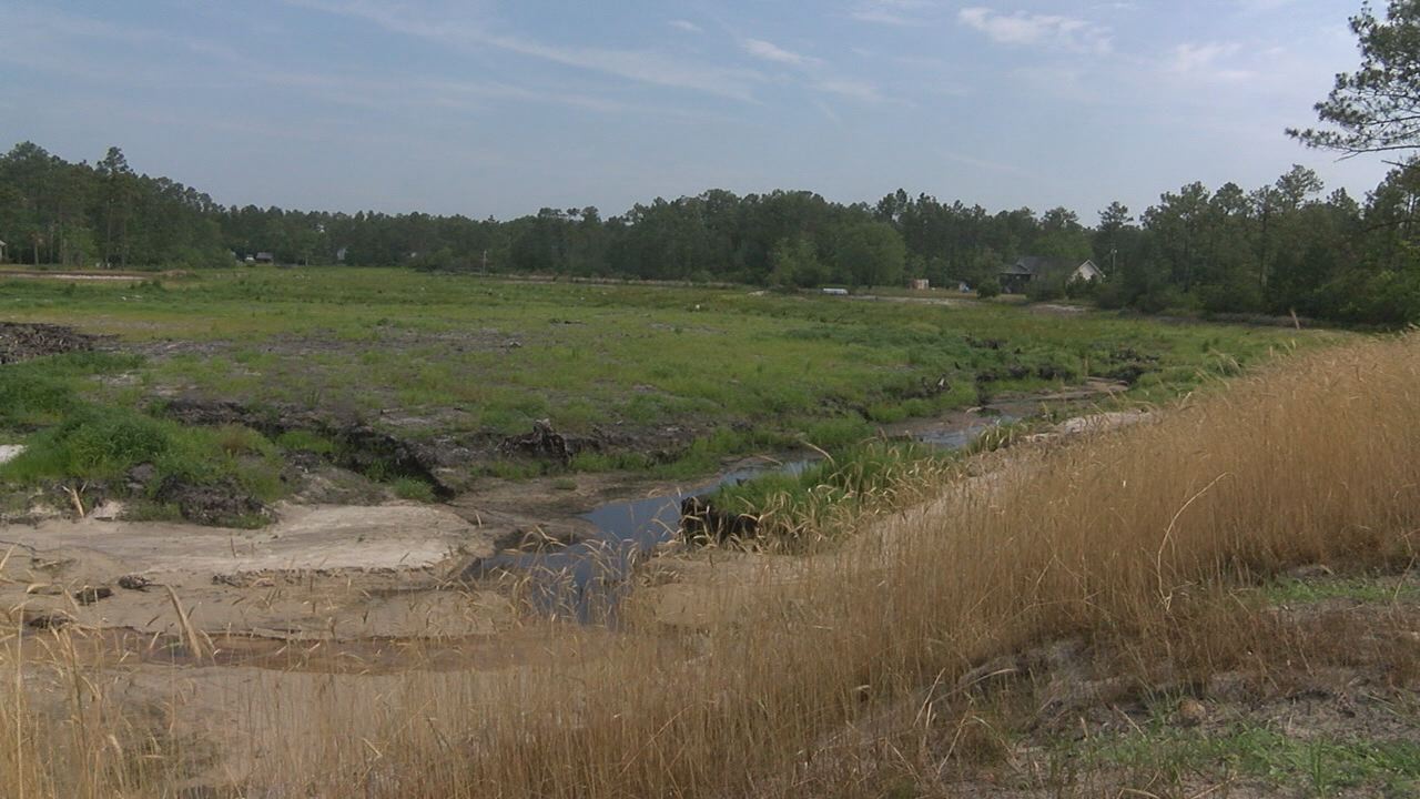 Boiling Spring Lakes dam project new projected completion date of