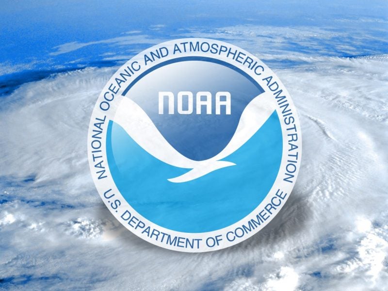 NOAA logo over clouds