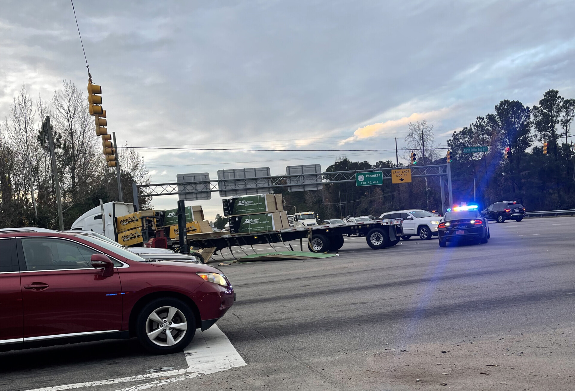 Road reopens in Wilmington after tractor trailer loses part of its load ...