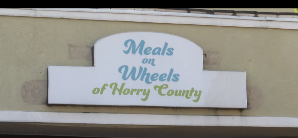 A sign reads "Meals on Wheels of Horry County"