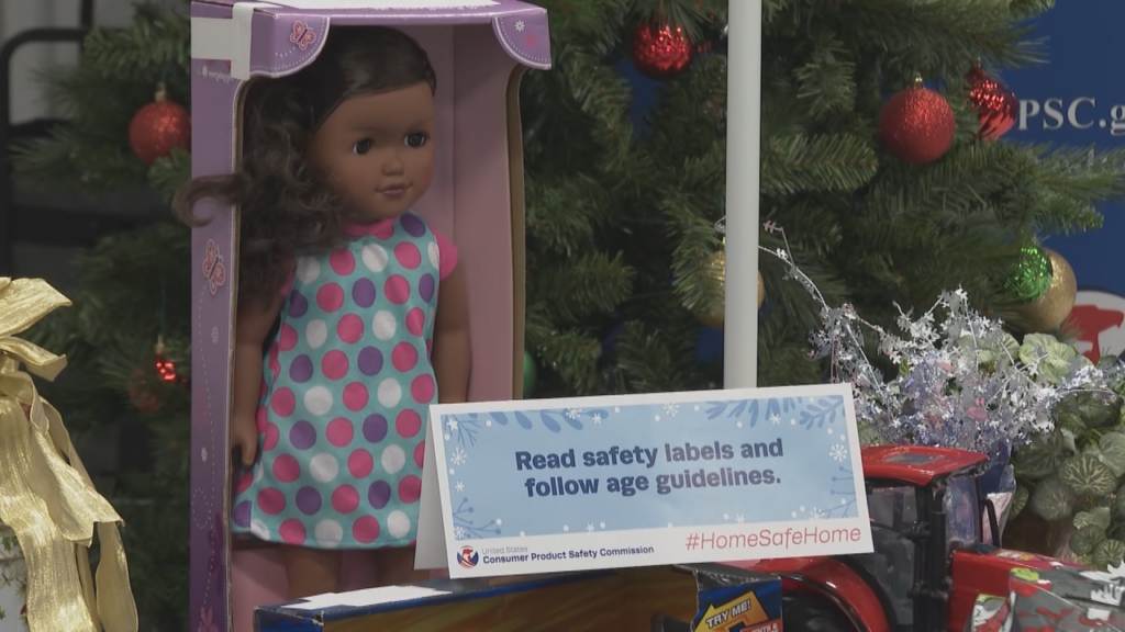 A sign warns consumers to read safety labels and follow age guidelines for toys.