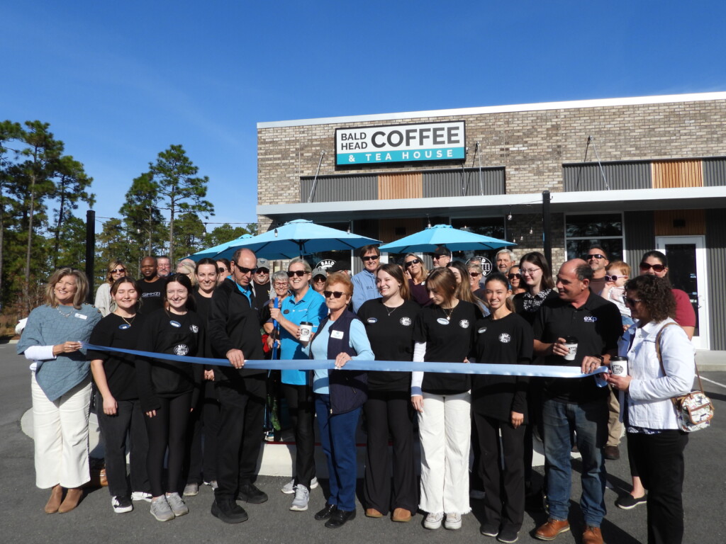 Steve and Pam Lewis, and Brunswick County Commissioner Pat Sykes cut the ribbon for Bald Head Coffee.