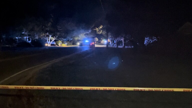 WPD: Man in custody after threatening officers, police fired shot into ...