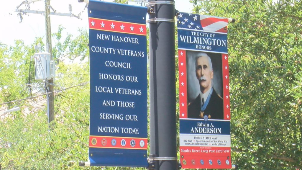 In downtown Wilmington, some veterans are being honored with tribute banners. Dozens were unveiled at the Hannah Block Historic USO Community Arts Center, telling the stories of veterans, (Photo: Emily Andrews/WWAY News).