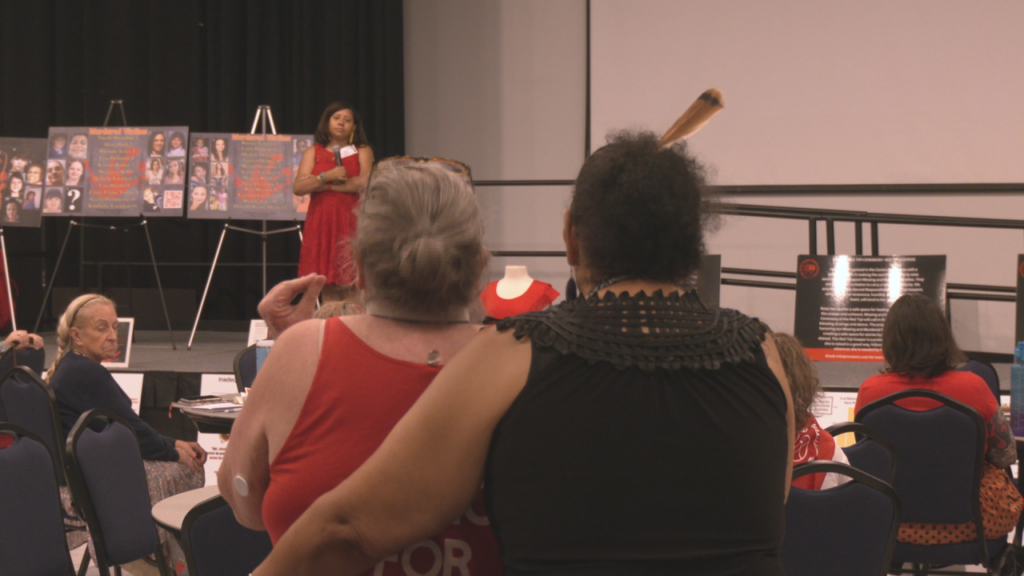 Family members grieving the loss of a loved one share their story, and write messages on a red dress, a widely recognized symbol of the movement. (Photo:WWAY)
