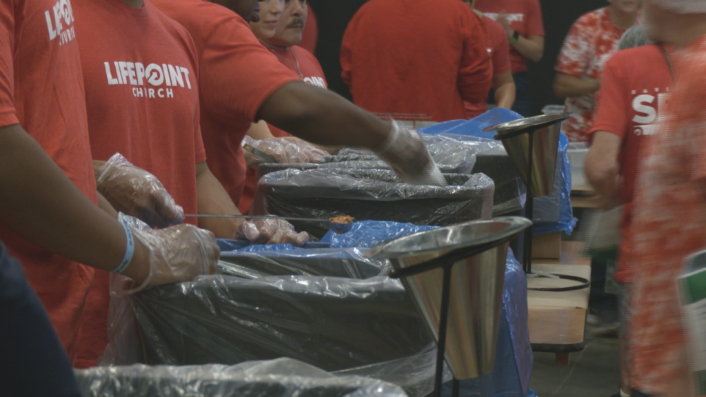 Volunteers prepare pre-packed rice kits to be sent abroad on July 13, 2024. (Photo:Nate Mauldin/WWAY)
