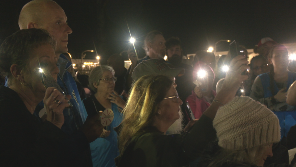 Dozens gather outside of the Monkey Junction Walmart in Wilmington to remember the life of Mark Paz on November 9, 2024. (Photo: Nate Mauldin/WWAY)