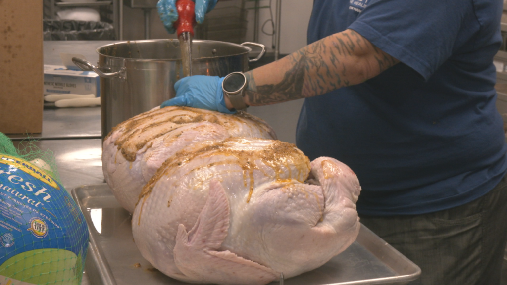 Volunteers and employees at The Healing Place prepare the organization's second annual Thanksgiving meal on November 27, 2024. (Photo: Nate Mauldin/WWAY)