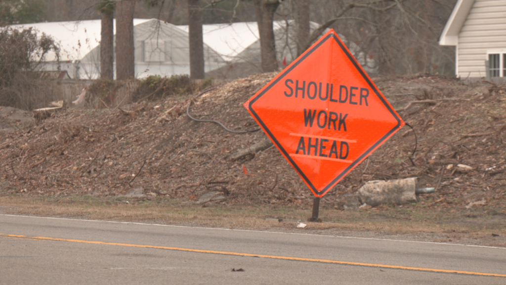 Crews begin clearing space on the shoulder of Gordon Rd. ahead of an expansion starting in 2025. (Photo: Nate Mauldin/WWAY)