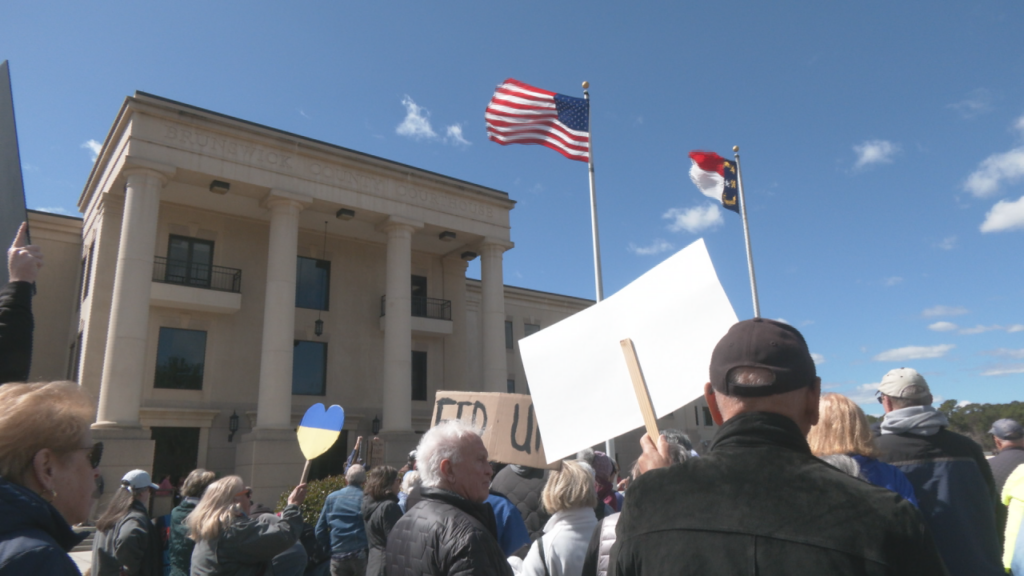 Protesters gather outside of the Brunswick County Courthouse in Bolivia on March 6, 2025. (Photo: Nate Mauldin/WWAY)